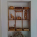 The shelves with my collection of carvings.